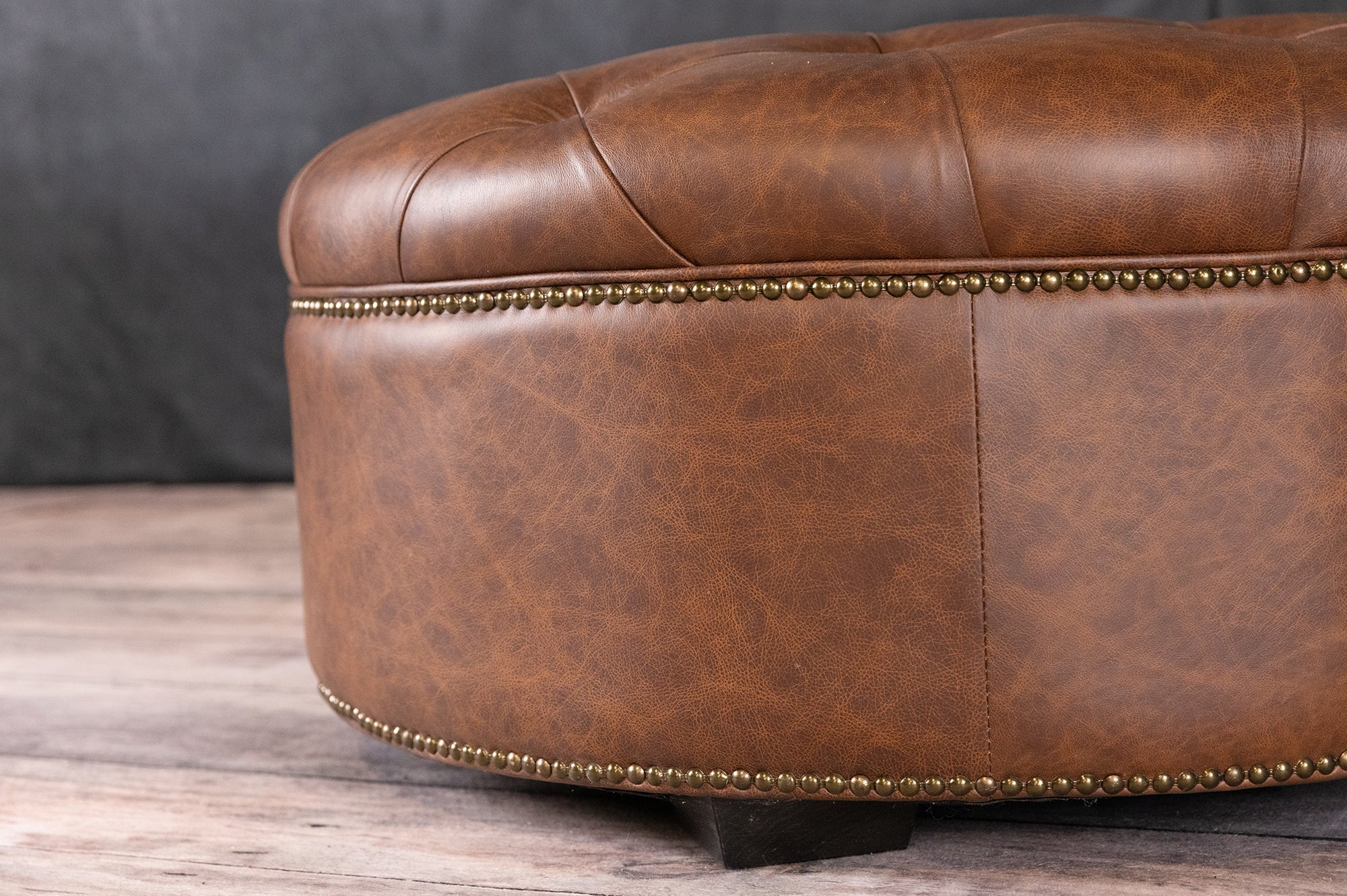 ARTHUR ROUND TUFTED OTTOMAN